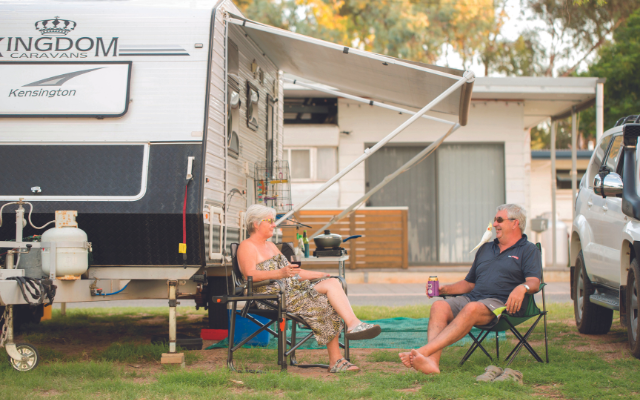 nomads sitting at caravan site