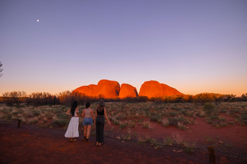 Three people admiring the Olgas